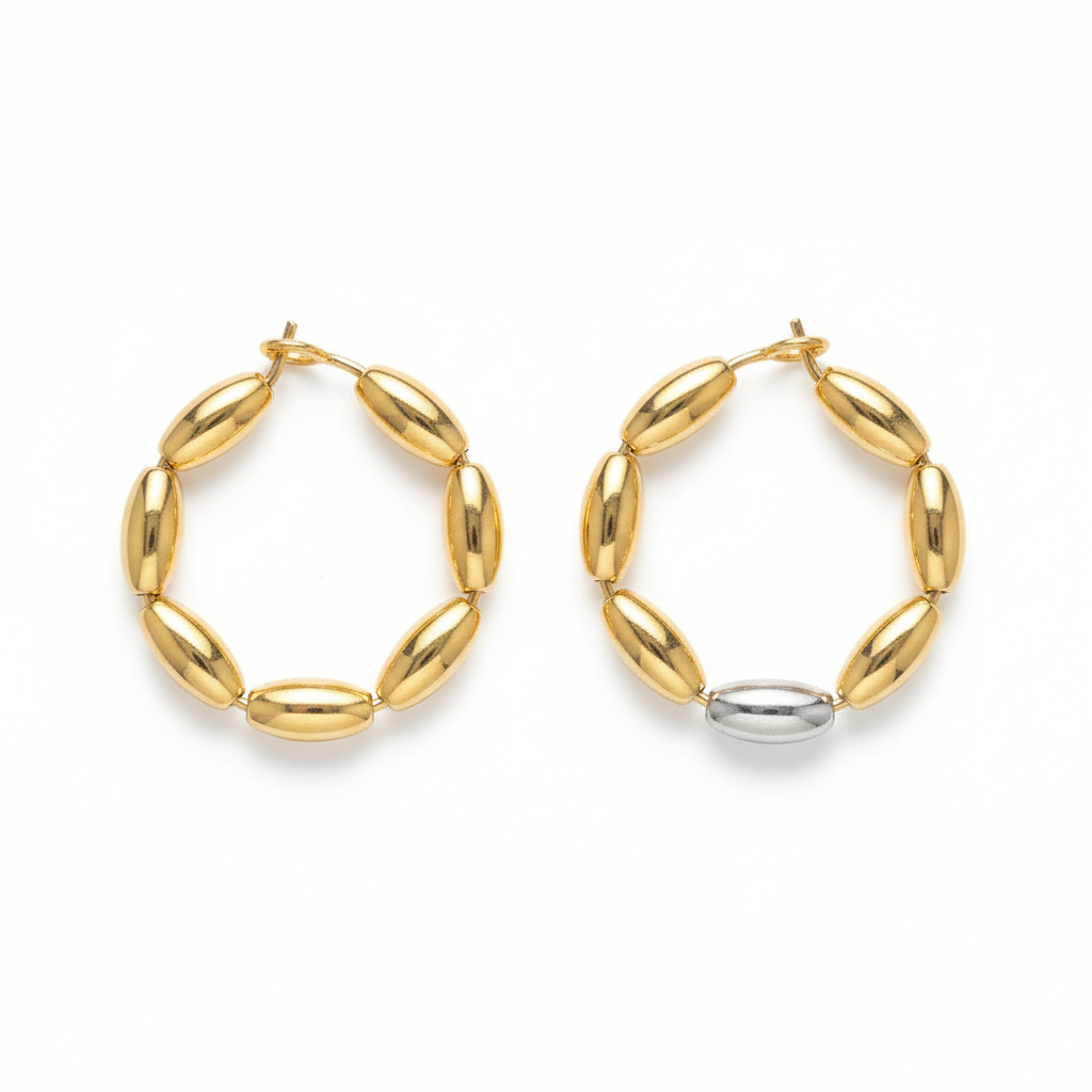 image_071c8912-d65b-4312-b485-72fe14a3e838 Two-tone gold and silver oval bead hoop earrings on white background