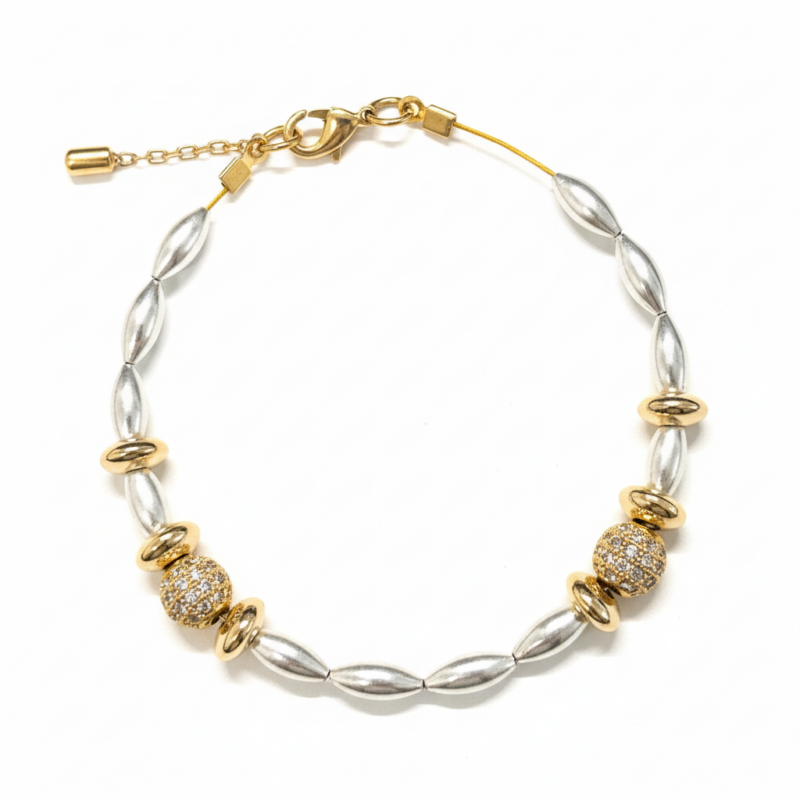 Silver rice pearl and gold pavé ball bracelet with rondelle spacers on white background