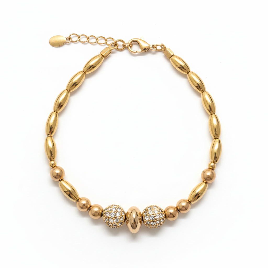 image_cafa359a-5cda-48a7-8f91-784bb2018929 Gold-tone pavé crystal beaded bracelet with oval beads and lobster clasp on white background