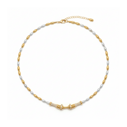 Two-tone silver and gold rice pearl necklace with pavé crystal bar pendant on white background