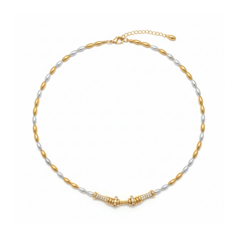 Two-tone silver and gold rice pearl necklace with pavé crystal bar pendant on white background