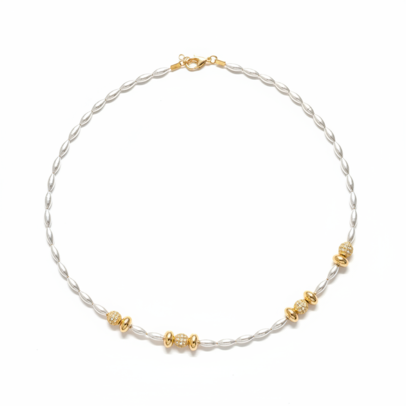 Silver rice pearl and gold pavé beaded necklace on white background