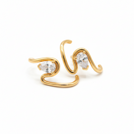Crystal Curve Earrings in gold tone on white background