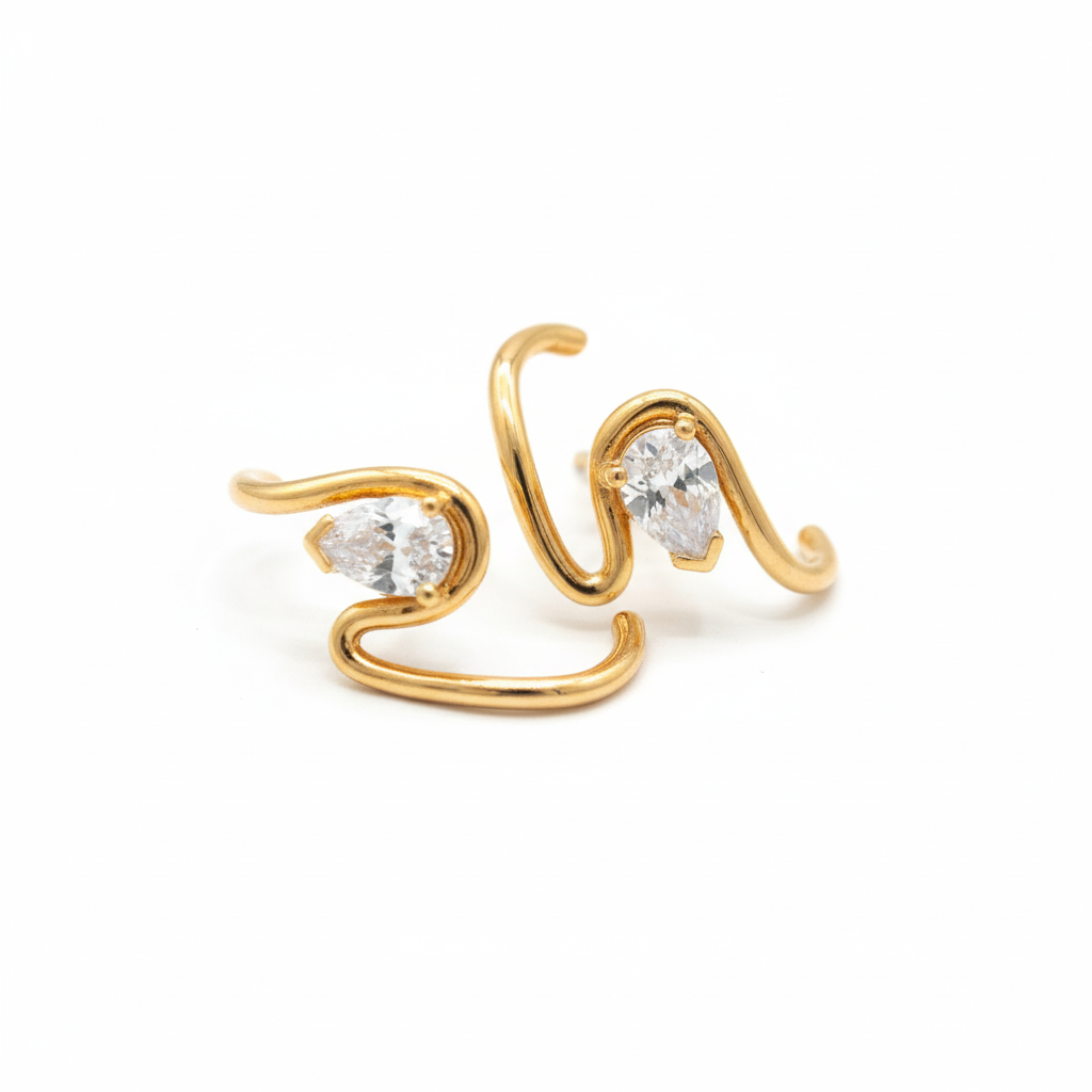 image_e128bcc4-0dec-4c20-bac0-e1d972a5bd77 Crystal Curve Earrings in gold tone on white background
